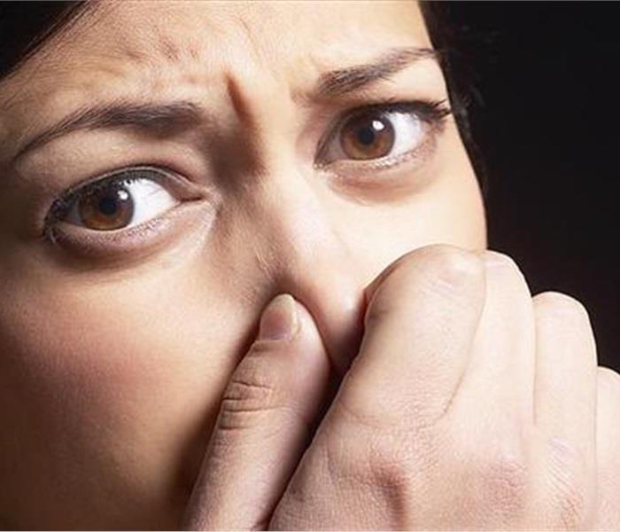 Person Holding Their Nose