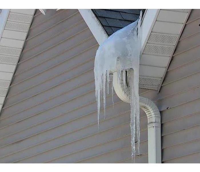 Icicles hanging off a house's gutter
