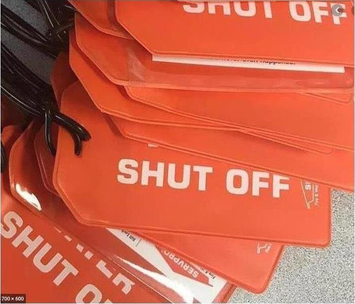A pile of tags labeled "SHUT OFF"