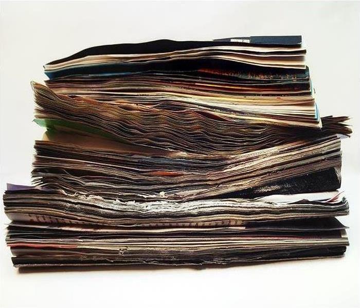 A pile of water-damaged documents