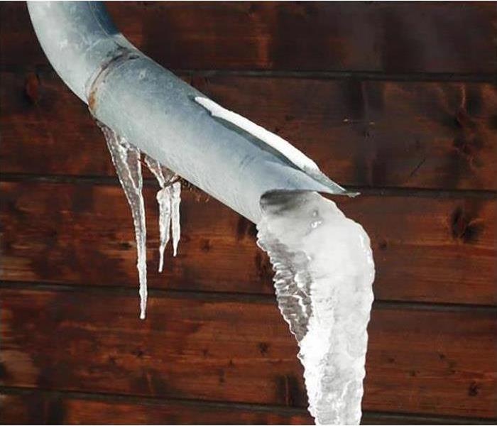 A frozen pipe with ice on it